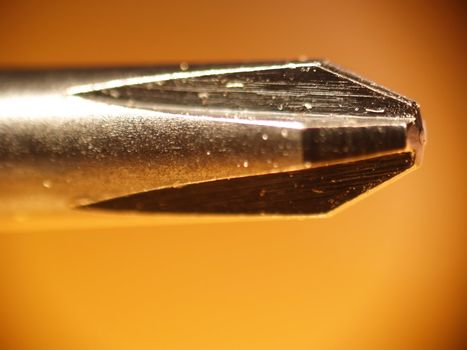 Macro of the tip of a phillips screwdriver