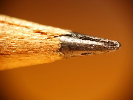 Macro of the tip of a pencil showing wood fibers and graphite