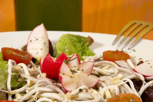 Elver salad dressed with olive oil and herbs