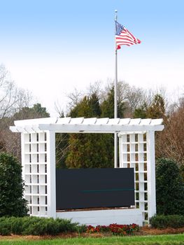 Corporate sign with arbor, flagpole and american flag, ready for you to customize