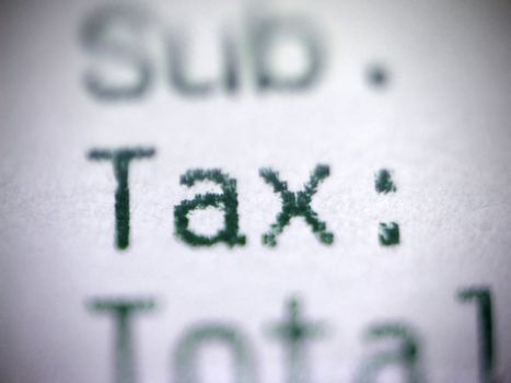 Closeup of a receipt focusing on the word TAX