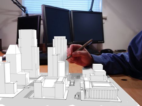 Architect drawing a city in 3d on his desk