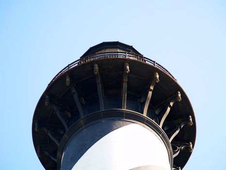 Closeup view of the top of a lighthouse