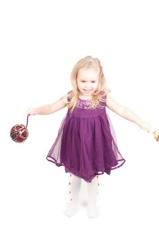 Studio shot of baby girl in lilac gala dress