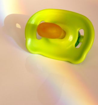 childs dummy with a rainbow across it