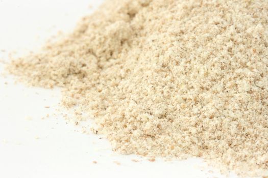 Close up view of whole grain / wholemeal flour on white background