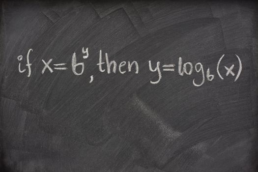 logarithm definition handwritten with white chalk on a school blackboard with eraser smudges