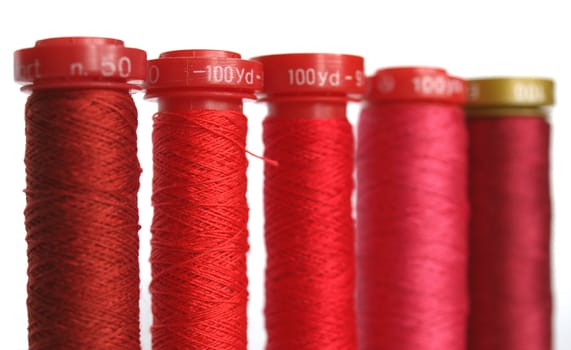 Red sewing threads spools