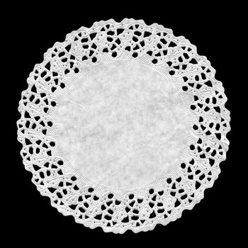 Small circular ornamental doily mat on black background