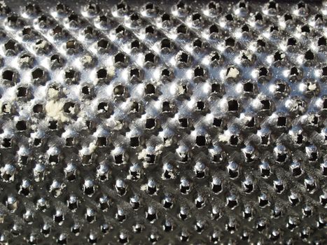 Detail of a steel grater kitchen tool