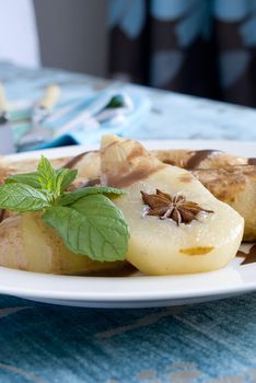 Rolled pancakes with poached pear