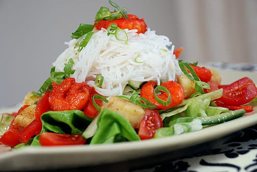 Delicious spicy prawn salad with rice noodles