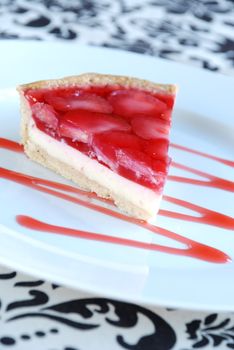 Strawberry tart with cream cheese and raspberry jelly