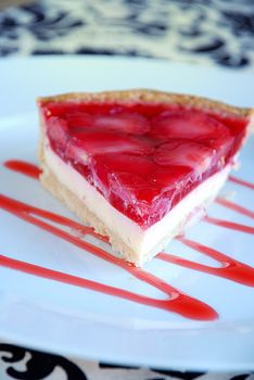 Strawberry tart with cream cheese and raspberry jelly