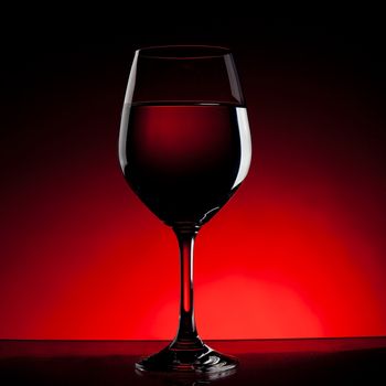 Wine glass outlines with red background.