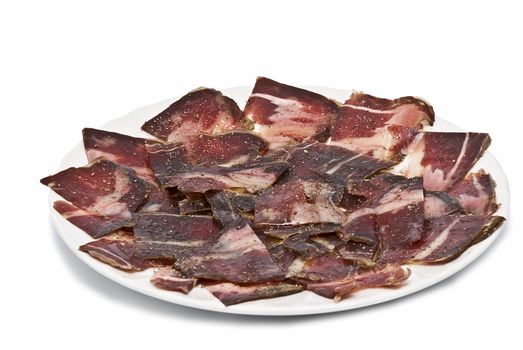 A plate of ham isolated on a white background.