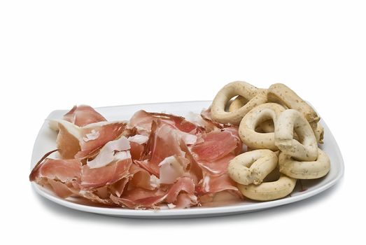 A plate of ham isolated on a white background.