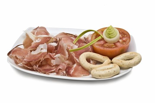 A plate of ham isolated on a white background.