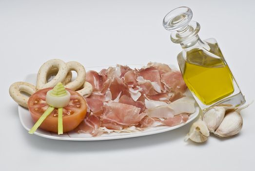 A plate of ham isolated on a white background.