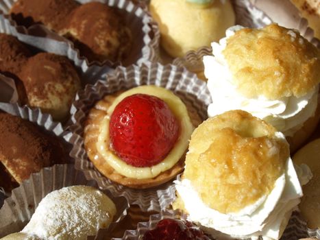 Mixed pastries with chocolate, cream, fruit