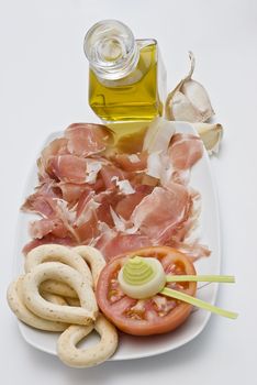 A plate of ham isolated on a white background.