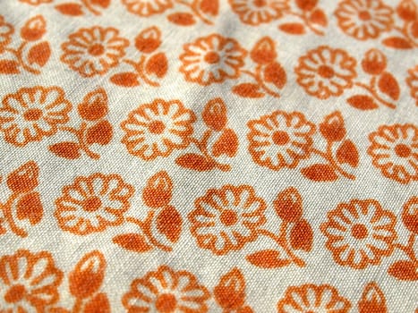 Fabric with orange floral decoration