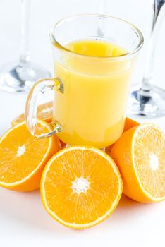 Fresh oranges and orange juice