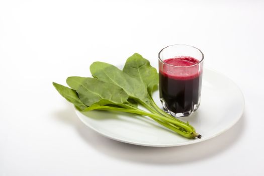 Fresh spinach  and beetroot juice isolated white background