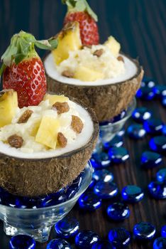 Coconut rice pudding with pineapple and strawberries
