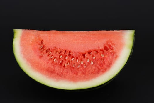 piece of watermelon, black background