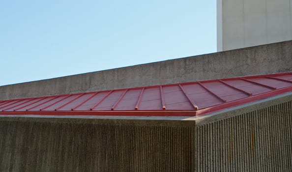 Abstract of various angles and textures of concrete steel roof against blue sky