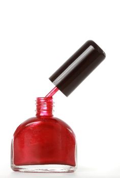 bottle of red nail polish, white background