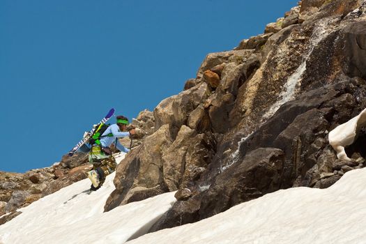 Freerider climbing a mountain, Caucasus, Elbrus, summer