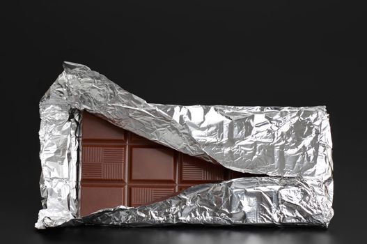 big chocolate bar in aluminium wrapping