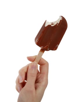 female hand holding a fudgicle, bite missing, white background