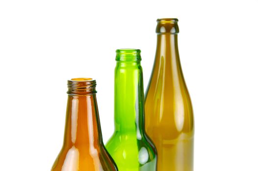Empty beer bottles isolated against a white background