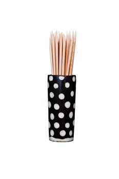 Wooden toothpicks in African spotted wooden holder