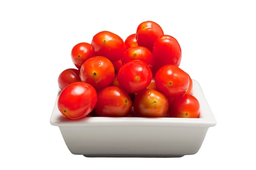 Fresh cherry tomatoes in a white bowl, isolated on white