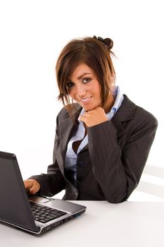 Young business student typing on a laptop