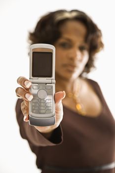 Woman holding out open cellphone.