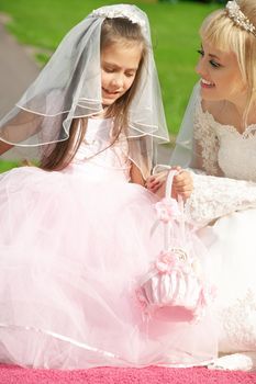 picture of happy bride and little bridesmaid