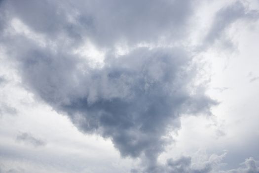 View of sky with large cumulus cloud formation.