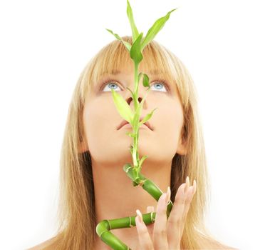 bright picture of lovely blond with bamboo