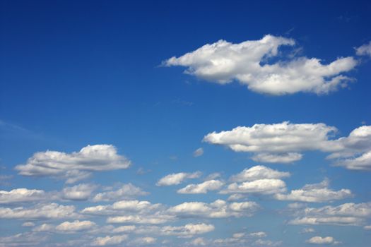 Peaceful clouds in blue sky.