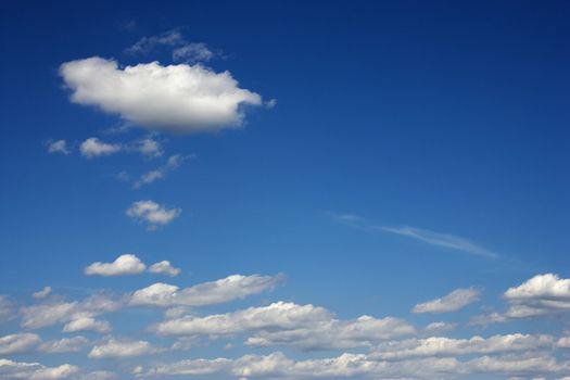 Peaceful clouds in blue sky.