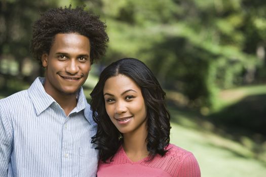 Attractive couple portrait in park.