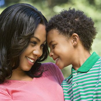 Happy smiling mother and young son portrait.