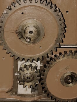 three different sized gear wheels, industrial detail