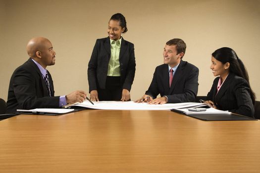 Businesspeople having meeting at conference table.