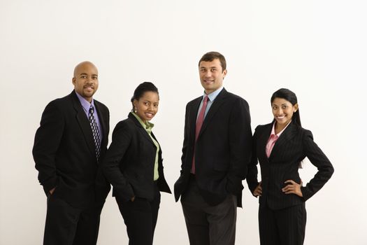 Portrait of businessmen and businesswomen standing smiling against white background.